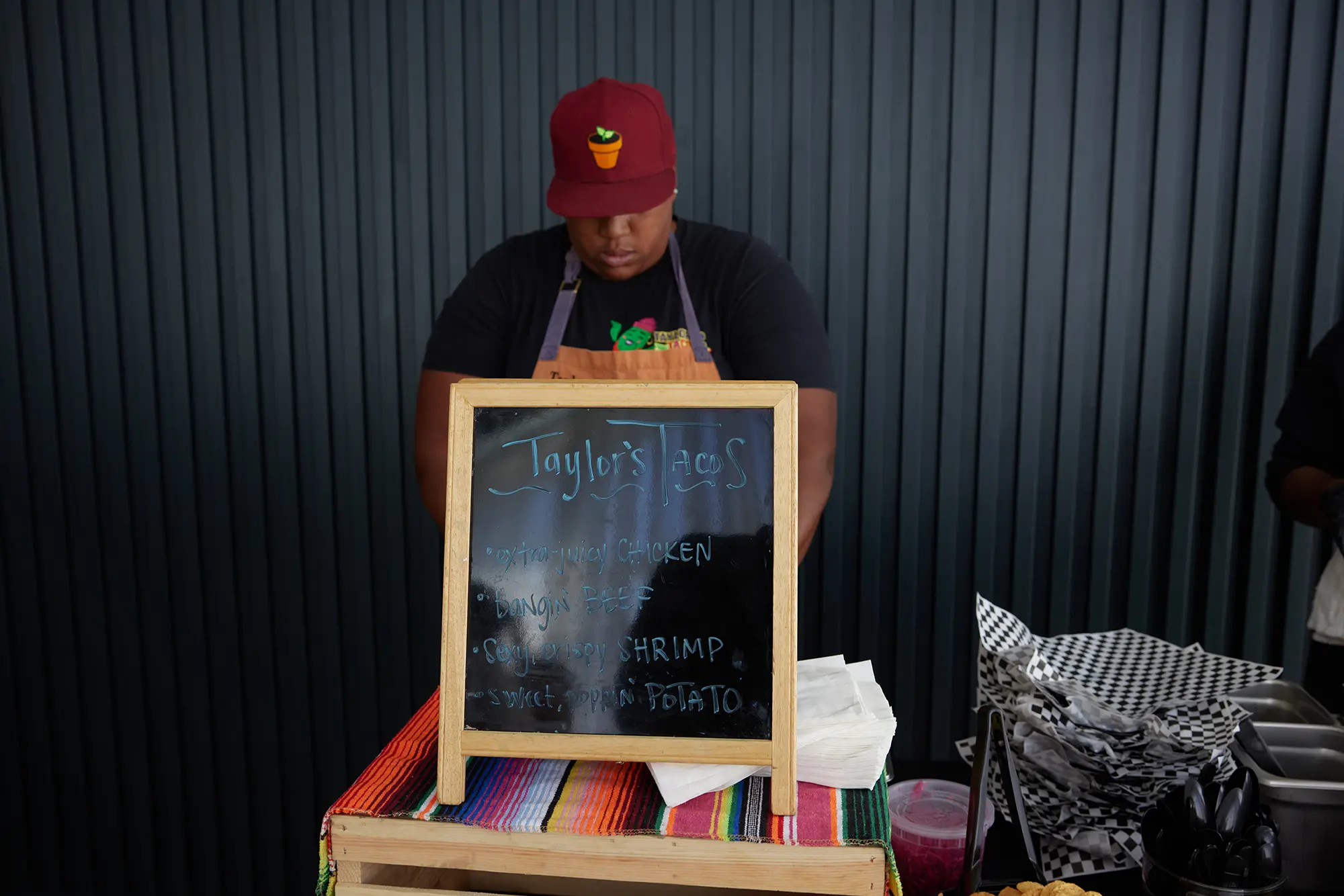 Taylor's Tacos Chicago menu board featuring chicken, beef, and shrimp taco options
