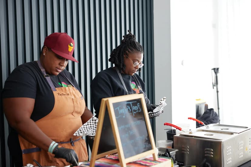 Taylor's Tacos Chicago staff preparing taco orders behind the service bar