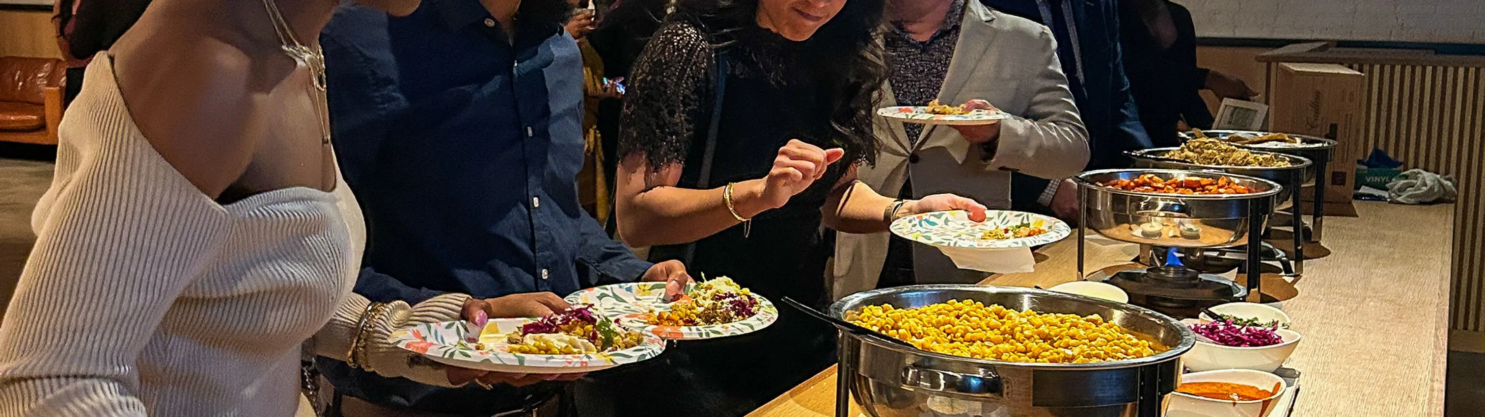 Guests serving themselves at a Taylor's Tacos Chicago catering buffet