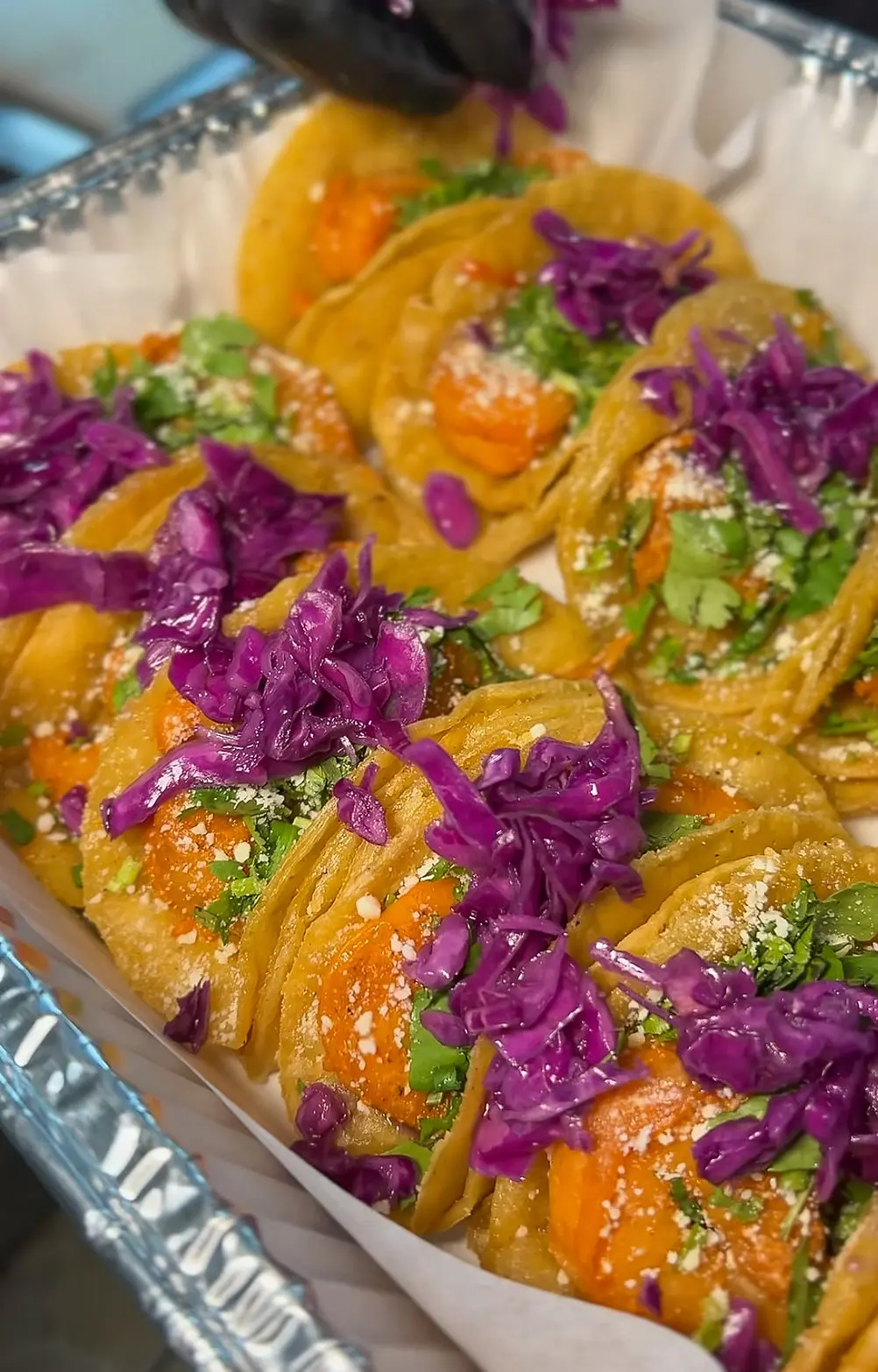Taylor's Tacos Chicago catering tray with purple cabbage and fresh toppings