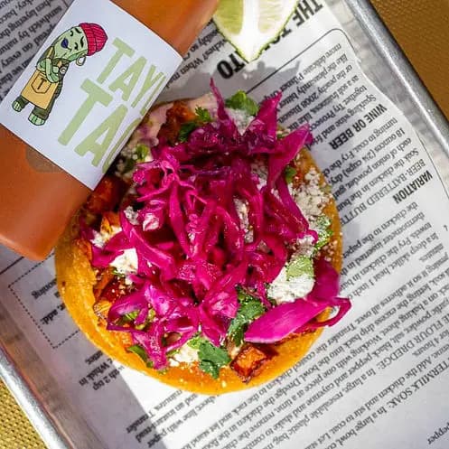 Taylor's Tacos Chicago carne asada taco with colorful fresh toppings