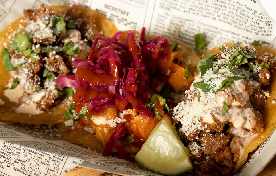 Taylor's Tacos Chicago street tacos served in newspaper wrap